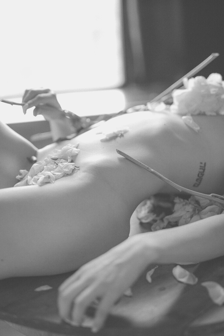  A Naked Woman Covered with Petals 